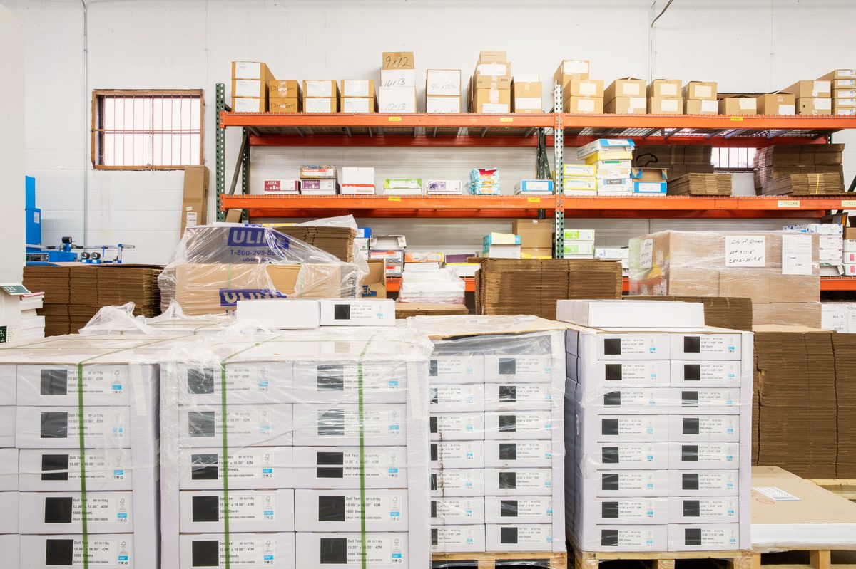 Pallet racking and boxed finished goods in Bell Litho's fulfillment warehouse